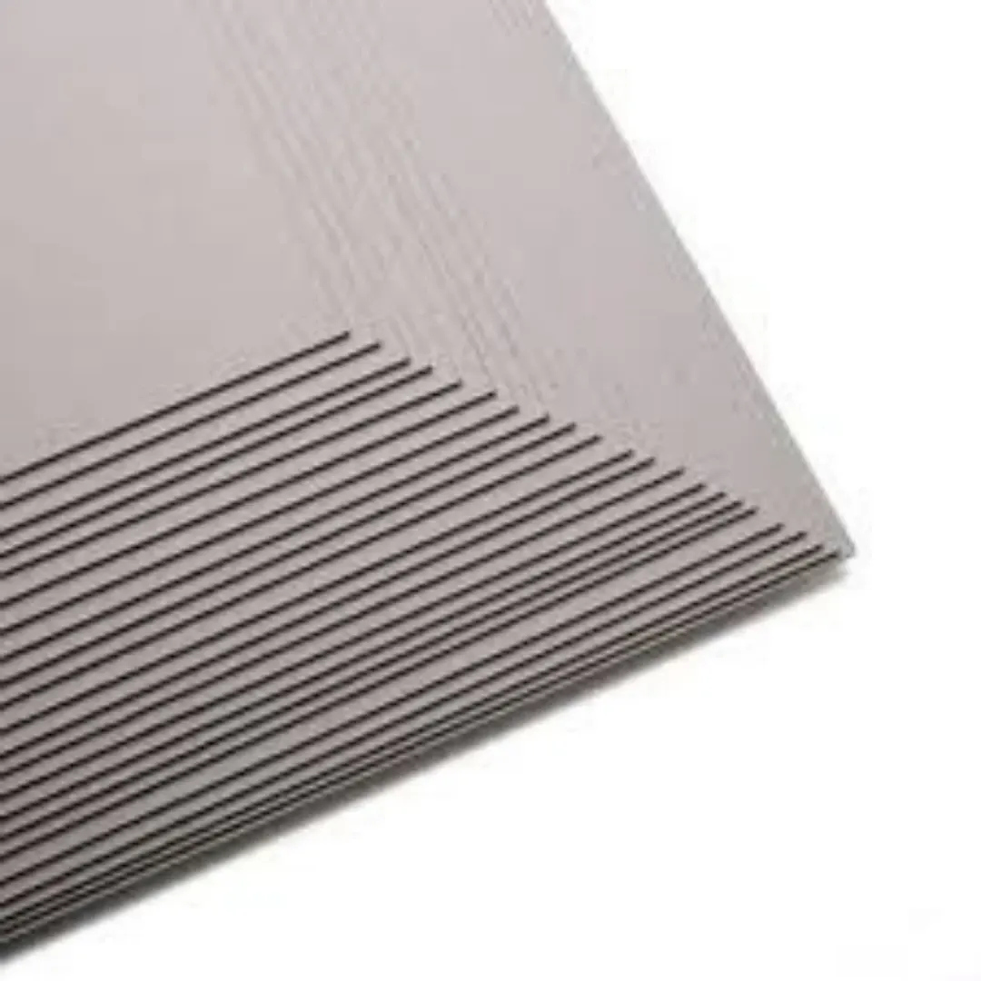 Edges of stacked greyboard sheets