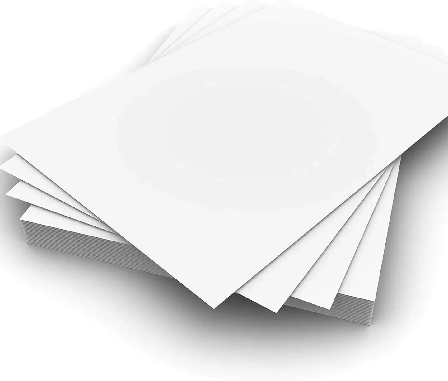 Fanned sheets of white matt coated paper